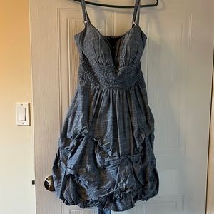 Denim, adjustable spaghetti straps. Ruffled bottom with straps on back